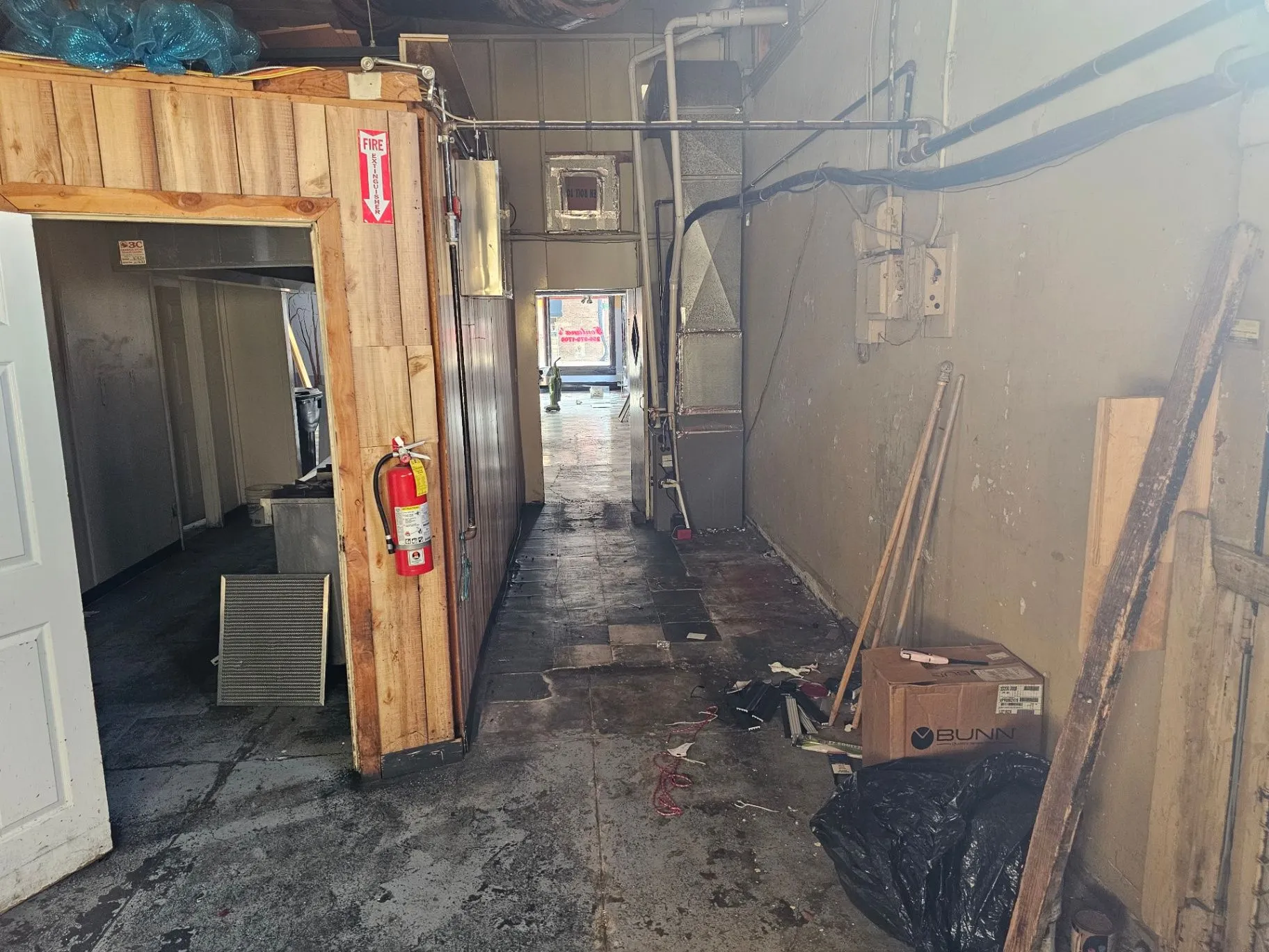 Back-of-house corridor and exposed services before the Wine Bar build
