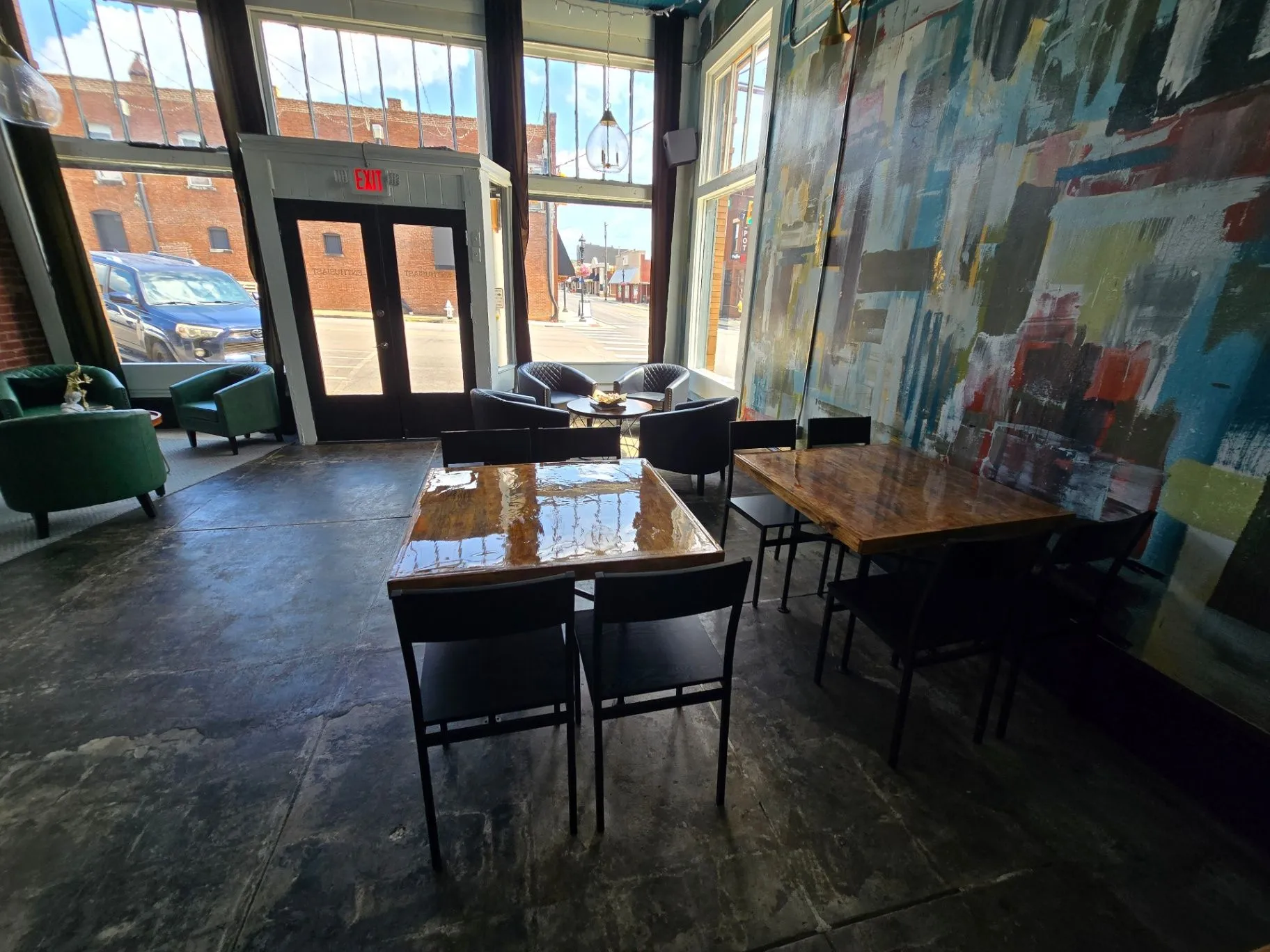 Completed Wine Bar seating area beside the front windows and mural wall